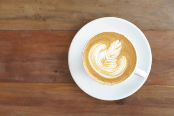 istock Cup of coffee with latte art pattern 1246992126