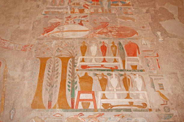 istock Hieroglyphic carvings on an ancient egyptian temple wall 1246996559
