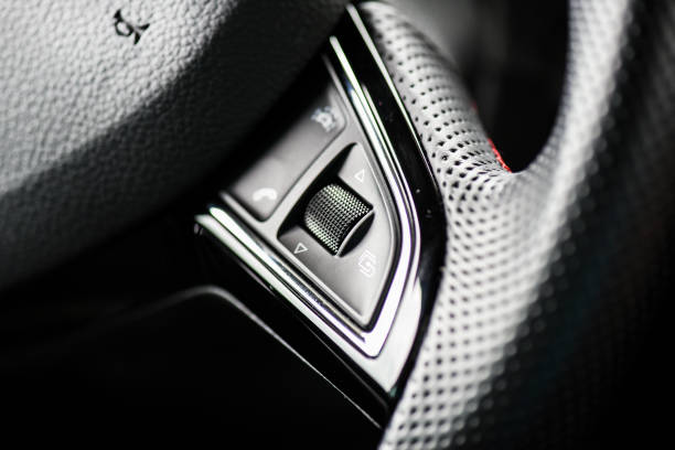 istock Right hand volume control on steering wheel in modern car. 1246996927