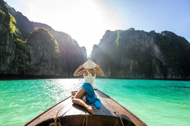 istock Beautiful woman on a long-tail boat in Thailand 1247002004