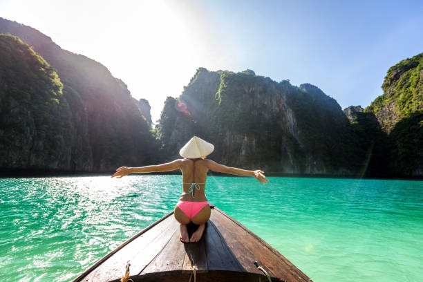 istock Beautiful woman on a long-tail boat in Thailand 1247005121