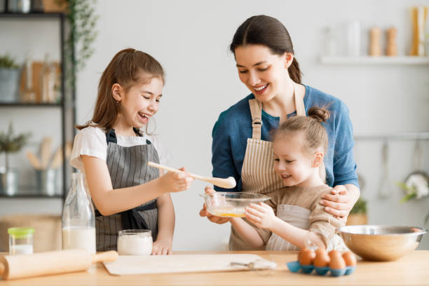 istock family are preparing bakery together 1247005244
