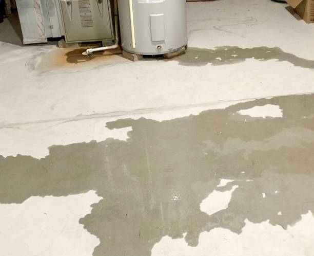 Water leak on basement floor Water intrusion in basement with visible water on basement cement floor basement stock pictures, royalty-free photos & images