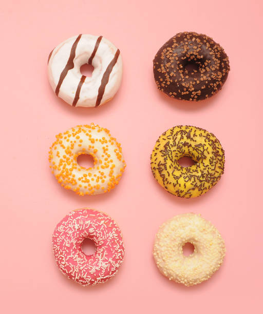 istock Delicious donuts on color background. 1247005555