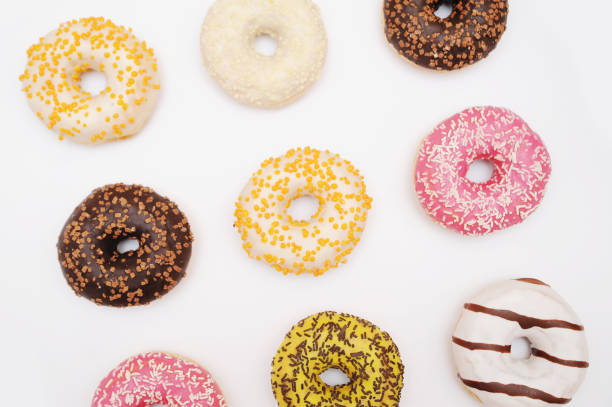 istock Delicious donuts on color background. 1247005616