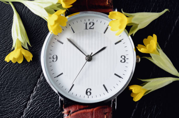 istock Watch with small yellow flowers 1247009178