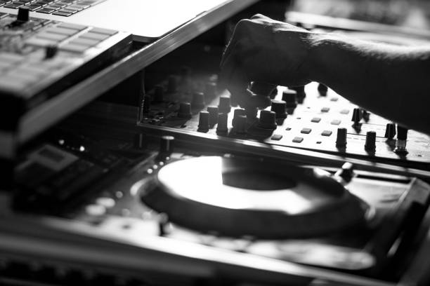 istock Dj turntables mixing party music in disco black and white 1247011258