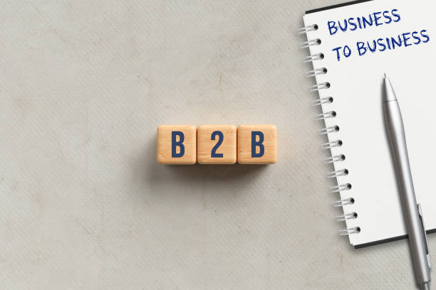 istock cubes with acronym B2B and notepad with explanation BUSINESS TO BUSINESS 1247011476