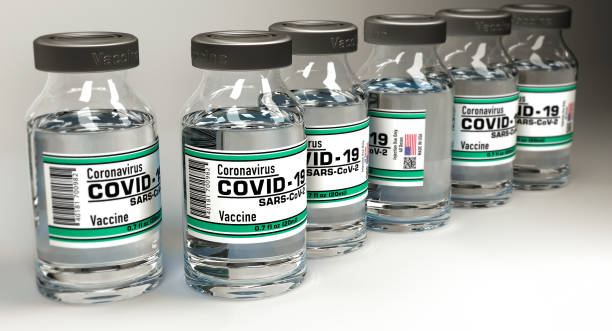 istock Covid 19 Vaccine bottles closeup image 1247016973