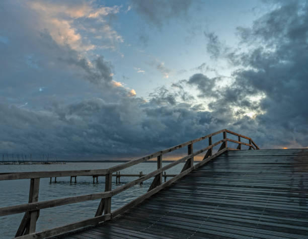 istock Promenade and bridge with majestic cloudscape at dusk 1247020871