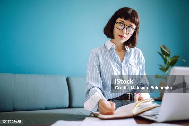 Beautiful Woman At Home Writing And Working With Diary Stock Photo - Download Image Now
