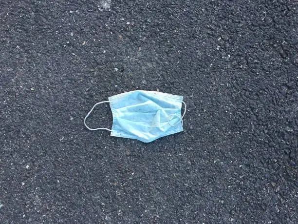 Photo of An abandoned face mask on the tarmac