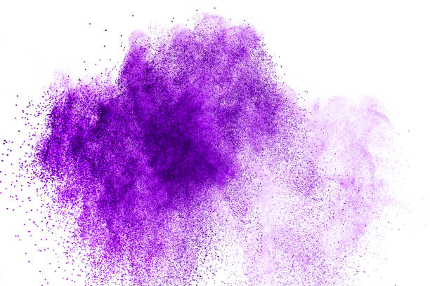 Purple powder explosion. Abstract closeup dust on backdrop. Colorful explode. Paint holi.