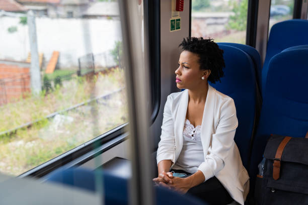istock Business woman traveling with train 1247036635