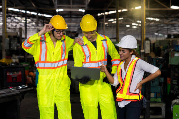 istock Engineers and skilled technicians are holding laptops and working in industrial plants. 1247036694