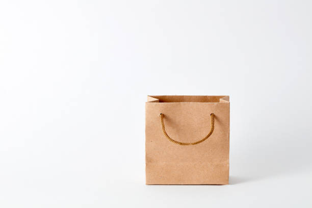 istock Miniature paper bag for shopping on white background 1247039580