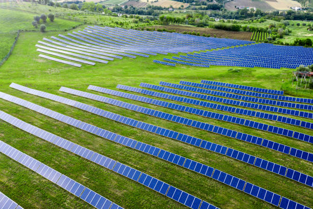 istock Solar panels fields on the green hills 1247046657