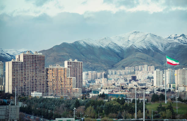 istock Tehran Skyline with Iran Flag and Alborz Mountains 1247053929