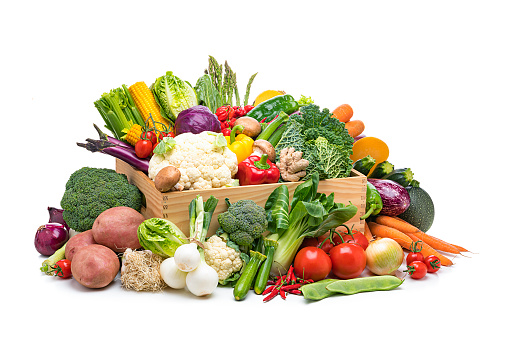 Healthy food: fresh organic vegetables in a crate isolated on white background. Vegetables included in the composition are kale, tomatoes, squash, asparagus, celery, broccoli, eggplant, onion, lettuce, carrots, corn, potatoes, ginger root, Bok Choy, cauliflower, bell pepper, edible mushrooms, radish, among others. High resolution 48,2Mp studio digital capture taken with Sony A7rII and Sony FE 90mm f2.8 macro G OSS lens