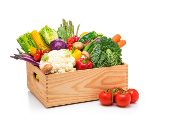 istock Crate filled with healthy fresh organic vegetables isolated on white background 1247073861