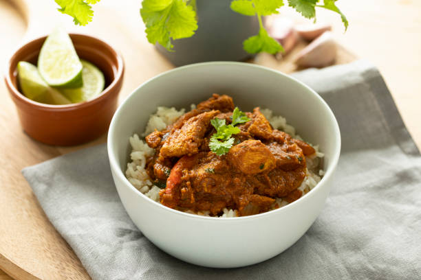 istock Chicken Jalfrezi curry with rice, coriander 1247075218