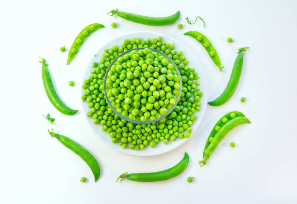istock Fresh green peas in a glass bowl 1247075531