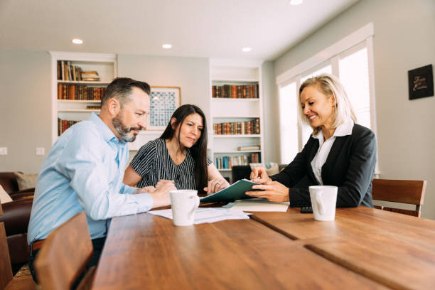 istock Financial Advisor Meeting with Couple 1247086026