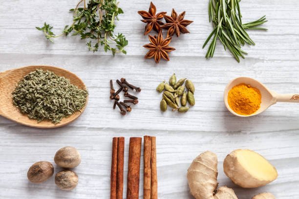 Top view health food knolling immune boosting properties with herbs, spices, plant, nuts. High in anthocyanins, antioxidants, smart carbs, minerals and vitamins light background. stock photo