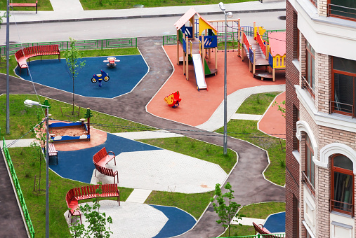 Aerial view outdoor workout playground for children in new residential area for sale. Urban development concept
