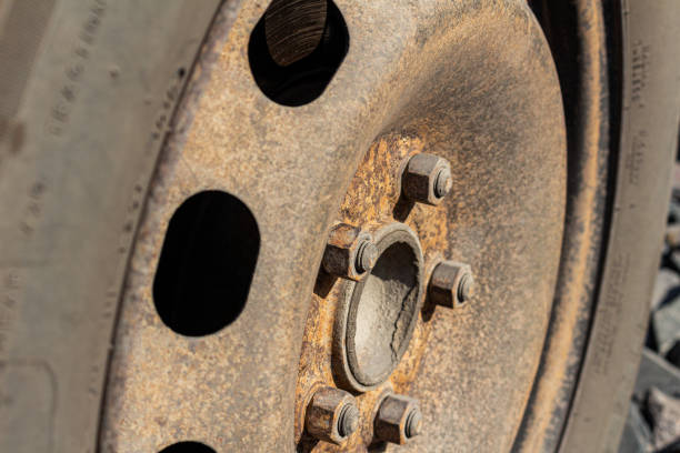 istock Old rusty steel auto wheel disc, car service. 1247120701