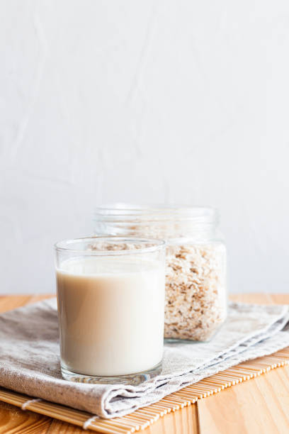 istock Oat milk in a glass on a table 1247122839