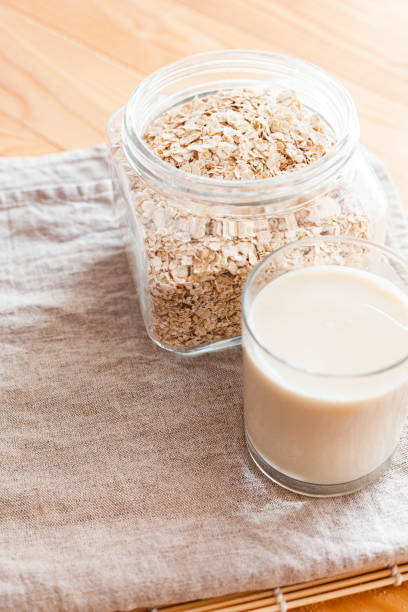 istock Oat milk in a glass on a table 1247123892