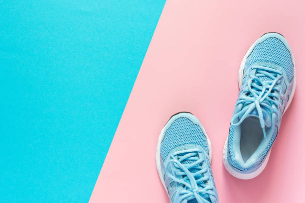 istock Blue sneakers isolated on colorful background 1247128698