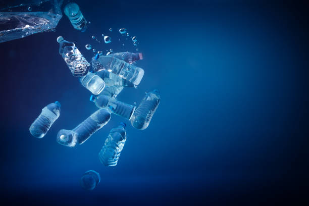 istock Plastic bottles sinking in to the ocean. Enviromental polution concept. World ocaens day 1247152868
