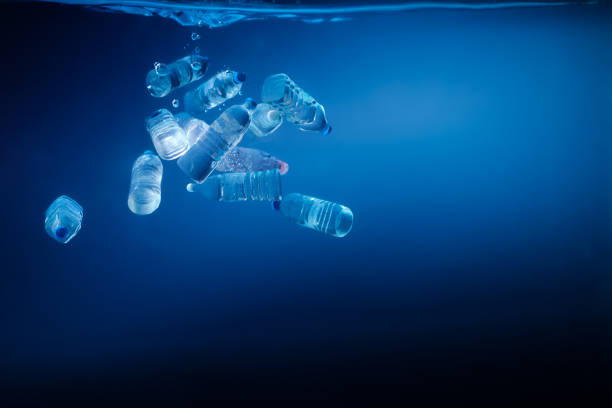 istock Plastic bottles sinking in to the ocean. Enviromental polution concept. World ocaens day 1247152872