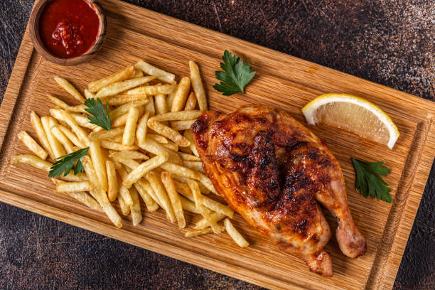 Half roasted chicken Piri Piri with french fries Half roasted chicken Piri Piri with french fries, top view halved stock pictures, royalty-free photos & images