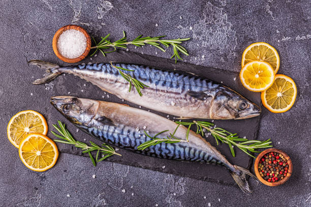 istock raw mackerel with spices on the board 1247153110