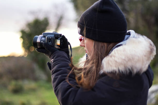 istock Girl with a camera. 1247153198