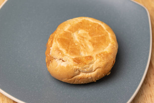istock close up round bread in blue plate 1247160806