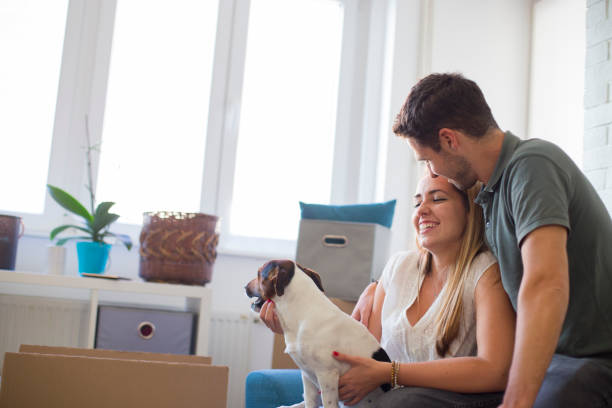 istock Young couple moving in into new apartment 1247164592