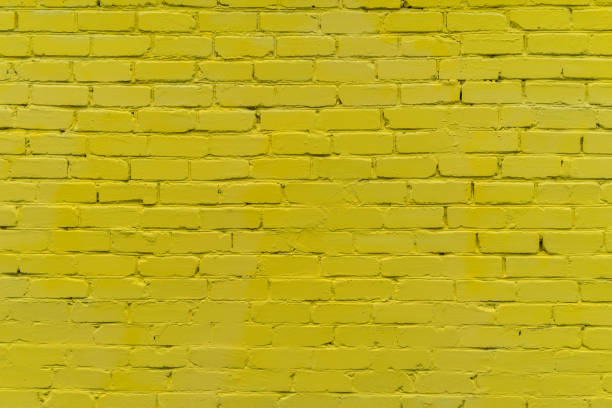 istock yellow brick red wall. background of a old brick house. 1247218397