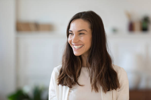 istock Smiling young woman look in distance visualizing 1247241335