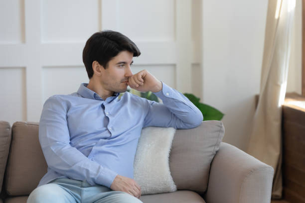 istock Thoughtful young man look in distance pondering over solution 1247241917