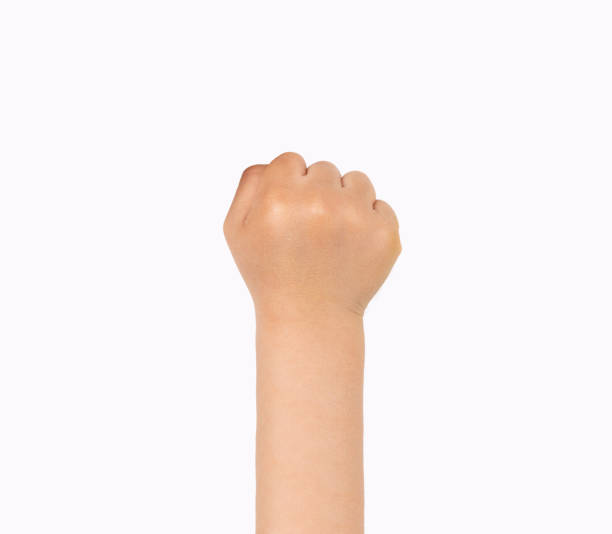 istock boy with fist up on a white background 1247245696