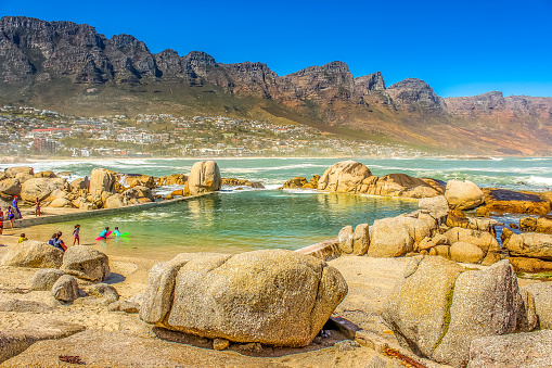 Beautiful Camps bay beach and rocky twelve apostles in Cape town South Africa