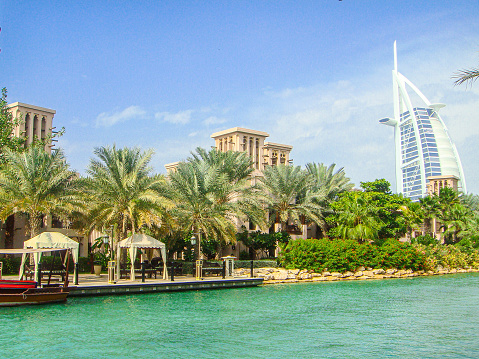 Dubai, United Arab Emirates - June 21, 2023: Souk Al Bahar Bridge near Burj Khalifa building in Dubai