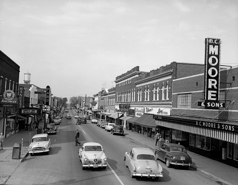 A view of downtown Lancaster, S.C. looking north on Main St. in November of 1953. The small mill town was home to Springs Cotton Mills for decades, which at one time boasted the world's largest cotton mill under one roof. (Photo by Lavoy Bauknight/Image on File with Travis Bell Photography)