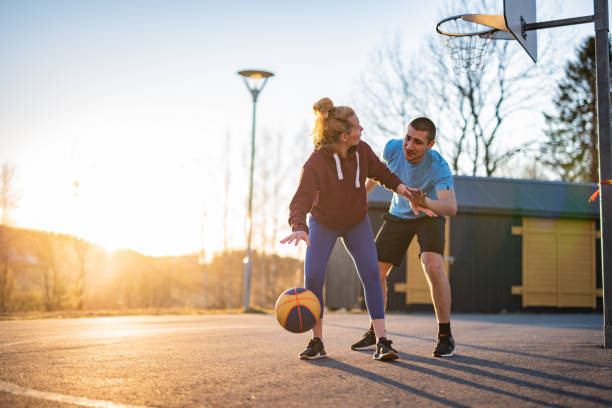 istock Young couple playing basketball. 1247296245