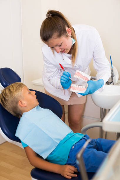 istock Dentist in white with is telling about healthcare 1247299923