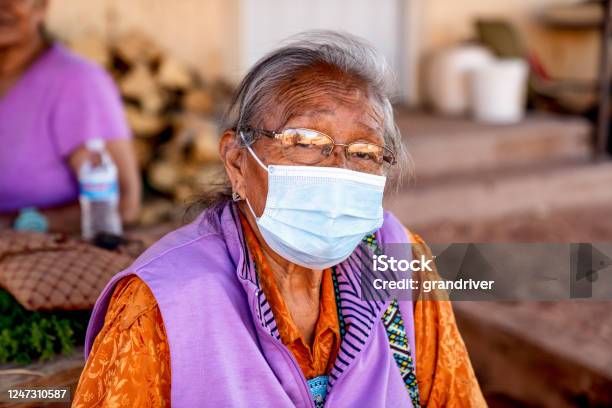 Aged Grandmother Navajo Woman Wearing A Mask To Prevent The Spread Of The Corona Virus Or Covi19 Stock Photo - Download Image Now